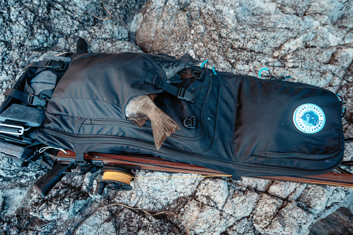 Cabezon-1 spearfishing backpack with speargun straps, black in use with gear